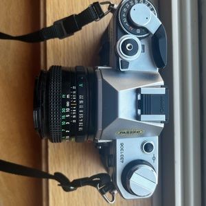 Canon AE-1 35mm SLR Film Camera with Canon 50mm f/1.8 FD Lens.